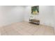 Neutral room design with an art piece and a bench with decorative pillows at 106 Madrid Dr, Casselberry, FL 32707