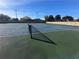 Outside tennis courts on a sunny day with blue and green surfaces at 106 Madrid Dr, Casselberry, FL 32707