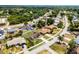 An aerial view of the property showcasing a well-maintained lawn and surrounding residential neighborhood at 1132 Feather Dr, Deltona, FL 32725