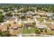 An aerial of a home in a residential neighborhood, showcasing the well-maintained lawns and tree-lined streets at 1132 Feather Dr, Deltona, FL 32725