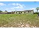 Well-maintained backyard with a sprawling lawn and mature landscaping at 1132 Feather Dr, Deltona, FL 32725