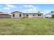 Expansive backyard with lush green grass, offering plenty of room to relax and play at 1132 Feather Dr, Deltona, FL 32725