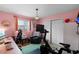 Home office/bedroom with Peloton, desk, and ample natural light at 1132 Feather Dr, Deltona, FL 32725