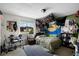 Eclectic bedroom featuring decorations, large window, and electronic drums at 1132 Feather Dr, Deltona, FL 32725