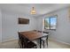 Traditional dining room featuring a wood table, six chairs, and natural light from a window at 1132 Feather Dr, Deltona, FL 32725