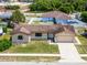 Charming single-story home with a well-maintained lawn, stone accents, and a two-car garage at 1132 Feather Dr, Deltona, FL 32725