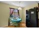 Cozy kitchen nook with wooden floors, eat-in dining set, and window at 1132 Feather Dr, Deltona, FL 32725