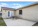Exterior patio featuring a table and chairs, and access to the house at 1132 Feather Dr, Deltona, FL 32725