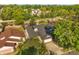 Aerial view of the charming home nestled among lush greenery and trees at 1532 Lawndale Cir, Winter Park, FL 32792