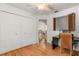 Bedroom with hardwood floors, a closet, and a desk area at 1532 Lawndale Cir, Winter Park, FL 32792