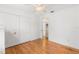 Bright bedroom with hardwood floors, closet, and ceiling fan at 1532 Lawndale Cir, Winter Park, FL 32792