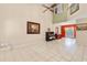 Spacious living room featuring neutral tile flooring and a piano at 1532 Lawndale Cir, Winter Park, FL 32792