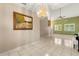 Bright living room with tile flooring, high ceilings, and a decorative chandelier at 1532 Lawndale Cir, Winter Park, FL 32792