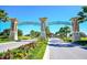 Scenic entrance to a community featuring lush landscaping and a welcoming gate at 1571 Plunker Dr, Davenport, FL 33896