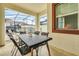 Covered patio area with outdoor dining table and a view of the screened-in pool at 1571 Plunker Dr, Davenport, FL 33896