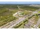 An aerial shot showcases community amenities like a playground, parking, and scenic walking trails at 6137 Blue Pond Way, St Cloud, FL 34771