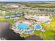 Community pool area showcasing resort-style amenities, a clubhouse, and tennis courts at 6137 Blue Pond Way, St Cloud, FL 34771