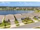 Aerial view of waterfront homes showcasing the community's picturesque lakefront setting at 6137 Blue Pond Way, St Cloud, FL 34771