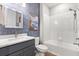 Bathroom featuring a modern vanity, a bathtub and shower with white tile surround at 6137 Blue Pond Way, St Cloud, FL 34771