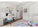 Bright bedroom with a white office desk and white shag carpeting at 6137 Blue Pond Way, St Cloud, FL 34771