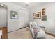 Bright bedroom with a white chaise lounge and white carpeting at 6137 Blue Pond Way, St Cloud, FL 34771