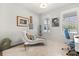 Bright bedroom with a white chaise lounge and white carpeting at 6137 Blue Pond Way, St Cloud, FL 34771