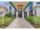 The community clubhouse with a beautiful entrance and lush landscaping offers a welcoming arrival at 6137 Blue Pond Way, St Cloud, FL 34771