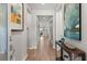 Inviting entryway featuring wood-look tile flooring, neutral paint, and stylish decor at 6137 Blue Pond Way, St Cloud, FL 34771