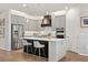 Updated kitchen with stainless steel appliances, a central island with barstool seating, and ample cabinet space at 6137 Blue Pond Way, St Cloud, FL 34771