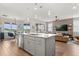 Open-concept kitchen features a large island, stainless appliances, and eat-in dining at 6137 Blue Pond Way, St Cloud, FL 34771
