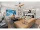 Open living area with modern furnishings and stylish decor, flowing into the kitchen with an island at 6137 Blue Pond Way, St Cloud, FL 34771