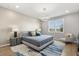 Serene main bedroom with large window, modern lighting, and comfortable furnishings at 6137 Blue Pond Way, St Cloud, FL 34771