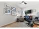 Bright office with a black desk and a gray reclining chair at 6137 Blue Pond Way, St Cloud, FL 34771