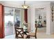 Inviting breakfast nook adjacent to lanai with outdoor grill, seating, and access to living room at 972 Bighorn St, Oviedo, FL 32765