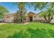Inviting single-story home with a well-manicured lawn, stone details, and a covered front entry at 972 Bighorn St, Oviedo, FL 32765