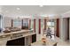 Open kitchen featuring stainless dishwasher, granite countertops, and breakfast nook with views to lanai at 972 Bighorn St, Oviedo, FL 32765