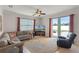 Comfortable living room features a plush sectional, decorative rug, and sliding glass doors to the patio at 972 Bighorn St, Oviedo, FL 32765
