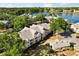 Aerial view of community located on the water, surrounded by beautiful green trees at 1063 S Hiawassee Rd # 1615, Orlando, FL 32835