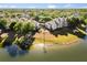 Stunning aerial view of the community near the water, surrounded by lush trees at 1063 S Hiawassee Rd # 1615, Orlando, FL 32835