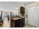 The kitchen area features granite countertops and access to a pantry at 1063 S Hiawassee Rd # 1615, Orlando, FL 32835