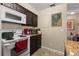 Efficient kitchen with appliances, complemented by a tile backsplash and ample counter space at 1063 S Hiawassee Rd # 1615, Orlando, FL 32835