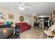 Bright living space showcases tile floors, ceiling fan, and seamless access to the kitchen at 1063 S Hiawassee Rd # 1615, Orlando, FL 32835