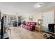 Cozy living room features tile floors, a ceiling fan, and ample natural light at 1063 S Hiawassee Rd # 1615, Orlando, FL 32835