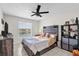 Bedroom with tile flooring, a ceiling fan, and views of the water at 1065 S Hiawassee Rd # 1436, Orlando, FL 32835