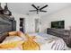 Bedroom with tile flooring, a dresser, a ceiling fan, and a walk in closet at 1065 S Hiawassee Rd # 1436, Orlando, FL 32835