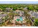 Beautiful community pool surrounded by palm trees, lounges, and manicured landscaping at 1065 S Hiawassee Rd # 1436, Orlando, FL 32835