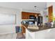 Kitchen with brown cabinets, granite countertops and tile flooring at 1065 S Hiawassee Rd # 1436, Orlando, FL 32835