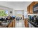Kitchen area featuring lots of natural light, granite countertops, and tile flooring at 1065 S Hiawassee Rd # 1436, Orlando, FL 32835