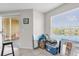 Sun room featuring a sliding glass door to the balcony, a large window, and tile flooring at 1065 S Hiawassee Rd # 1436, Orlando, FL 32835