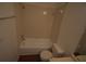 Clean bathroom with a combined shower and tub, toilet, and tile surround at 1075 S Hiawassee Rd # 916, Orlando, FL 32835